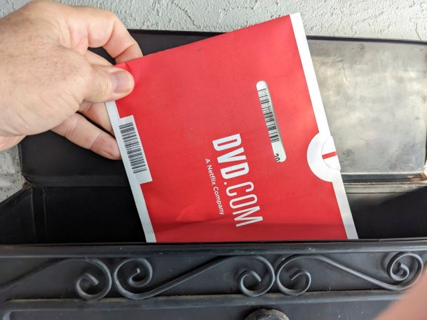 A Netflix DVD envelope is shown on Nov. 17, 2022 in San Francisco. Subscribers to Netflix's DVD-by-mail service still look forward to opening up their mailbox and finding one of the discs delivered in the familiar red-and-white envelopes. (AP Photo/Michael Liedtke)