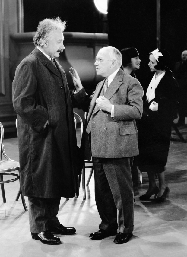 Dr. Albert Einstein, left, and Carl Laemmle, film executive, speak as the famed German scientist visits Hollywood motion picture studios, in Los Angeles, Nov. 1, 1931. It was later announced that Einstein had refused a large salary offer from a motion picture company. (AP Photo)