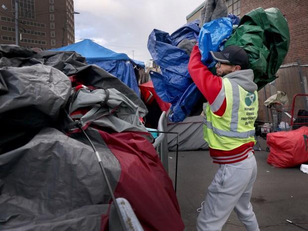 Boston, MA - Workers take down tents on Mass and Cass. November 01: . (Nancy Lane/Boston Herald)
