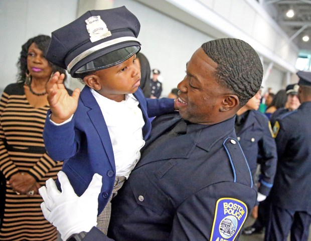 Boston, MA - October 27: Boston Police officer Jameel Dyer with his son Jayce 1 during his graduation ceremony at the BCEC. (Matt Stone/Boston Herald)