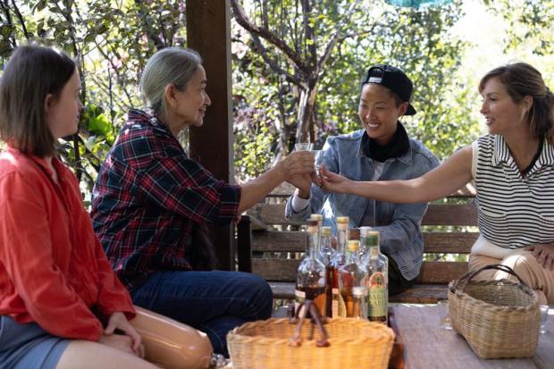 Maria Izabel, Chef Kristen Kish and Chef Gisela Schmitt sample the Brazilian spirit Cachaca at Maria Izabel's distillery to determine what might go best with their meal. Cachaca is a liquor produced from sugarcane in Brazil. (Courtesy Autumn Sonnichsen/National Geographic for Disney)