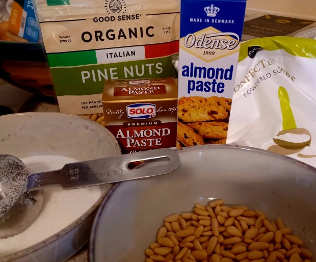 Diamond brand pine nuts are less expensive than these, but sometimes you have to go with what's in stock. Case in point, there was only one tube of the Odense almond paste on the shelf, so I had to get a Solo-brand box, as well. (Amy Drew Thompson/Orlando Sentinel)